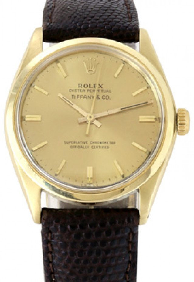 Rolex 1005 Yellow Gold on Strap, Smooth Bezel Champagne with Gold Index